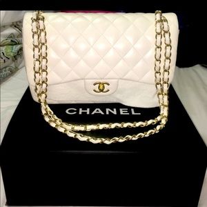 White leather Chanel designer bag with authentication card and original box